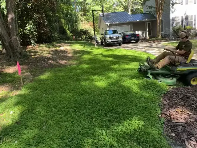 Mowing a shady front yard on a zero-turn mower