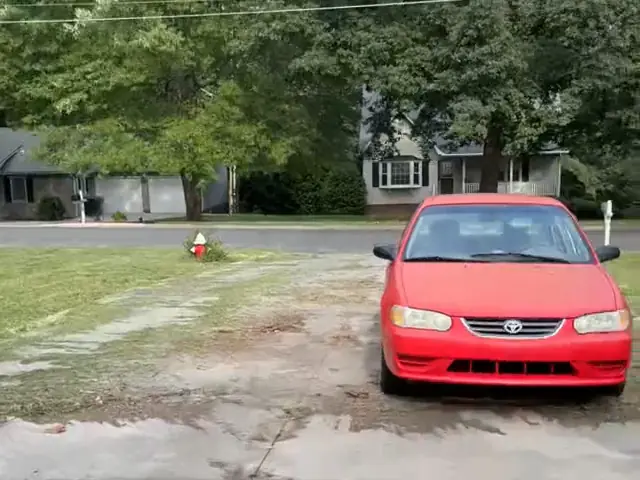 Blowing a driveway clear with a backpack blower